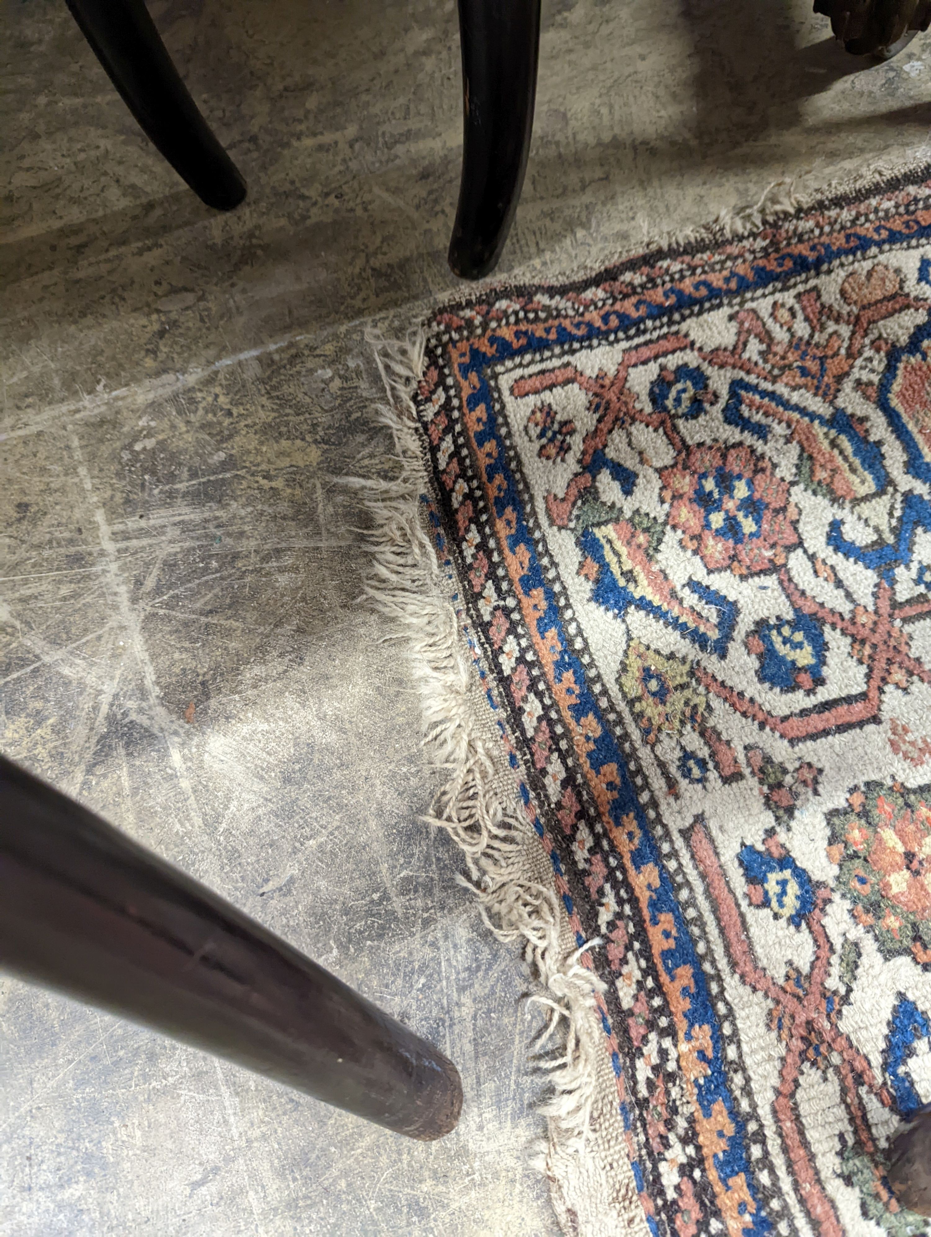 A Persian black ground runner, the central field including boteh motifs, 280 x 106cm, worn